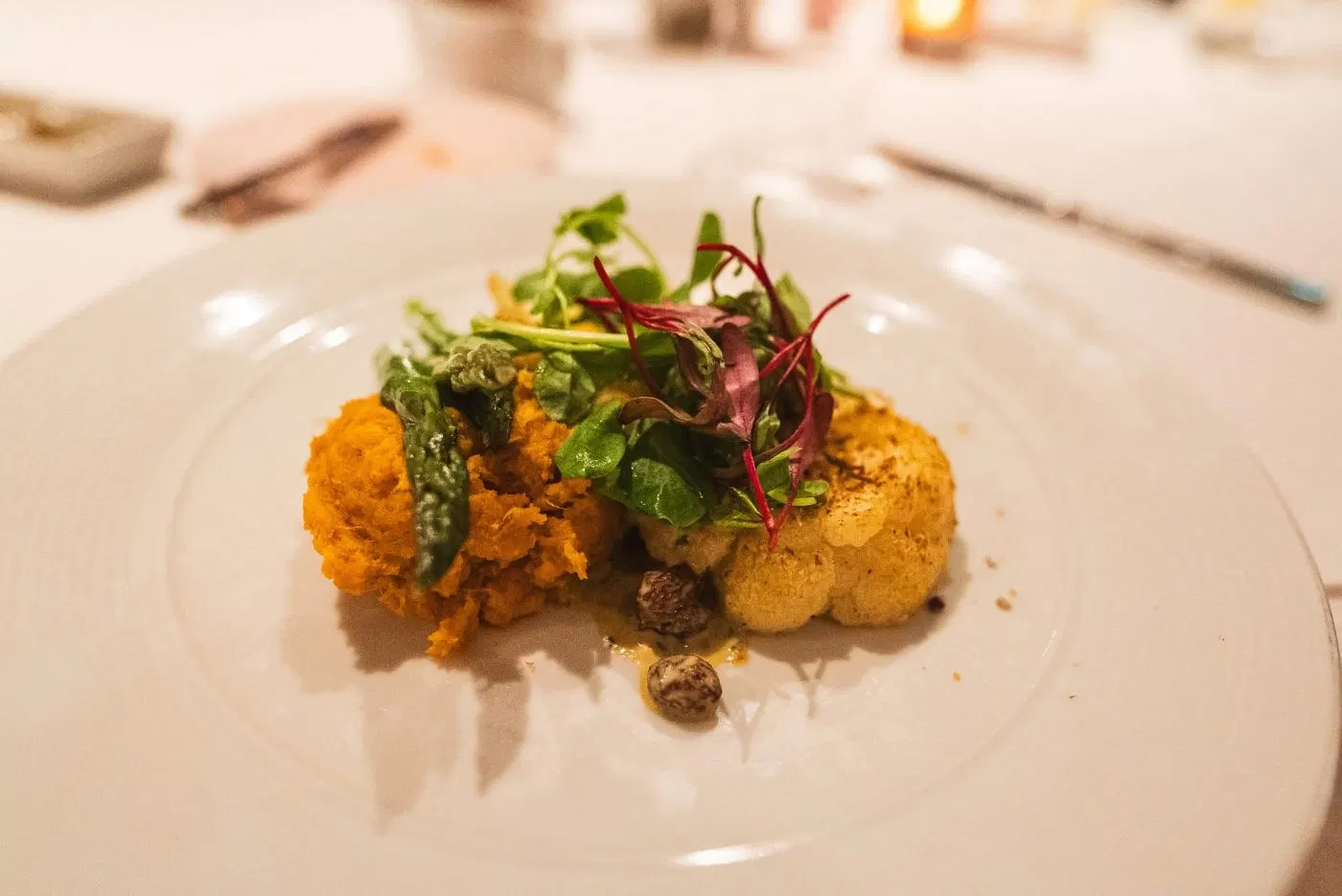 Roasted cauliflower steak plated for the cooked menu