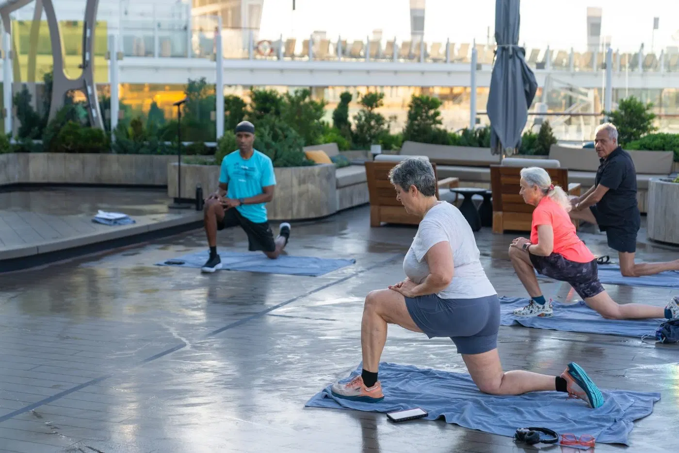 Guests in a morning movement session on the open deck