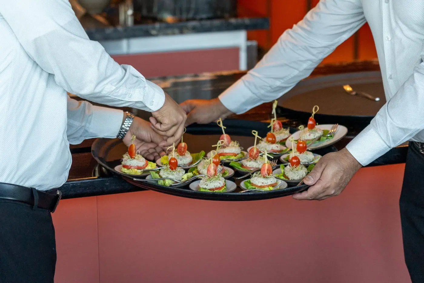 Starters being served at the white tablecloth dinner