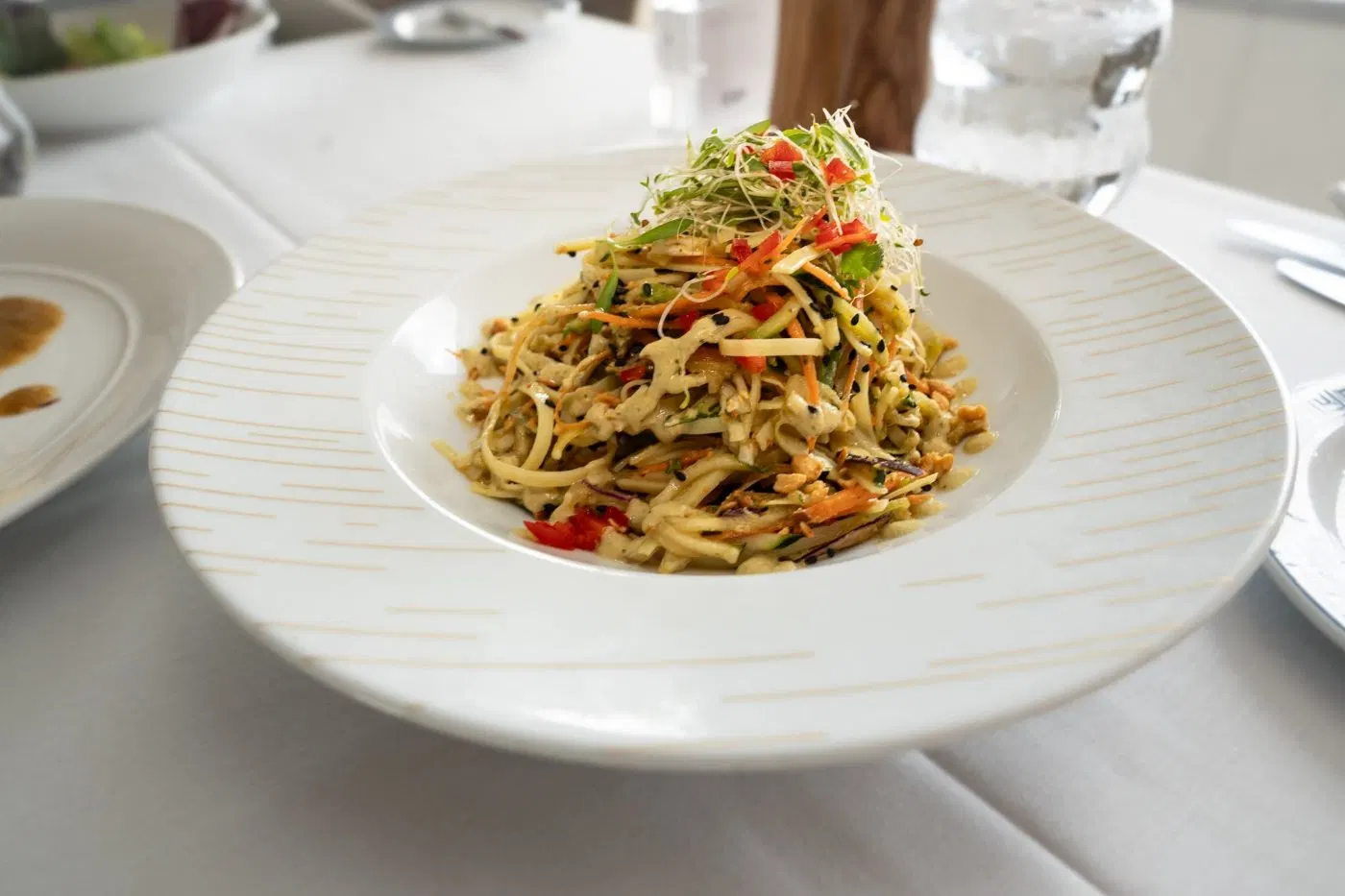 Raw vegetable noodles with cashew sauce