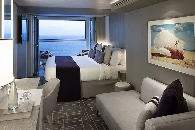 An AquaClass stateroom with an Infinite Veranda open to the water
